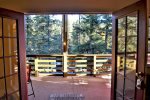 French doors open from deck to living room